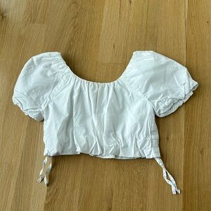 I am selling a white, smart casual crop top from Zara. Size 8 kids